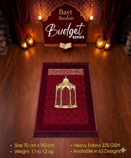 Red prayer mat with gold design on a wooden floor, featuring 'Bayt Barakah' branding.